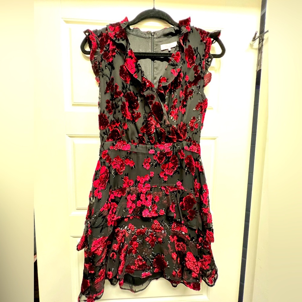 Parker size 2 black with rich red wine velour floral and shimmer detail.